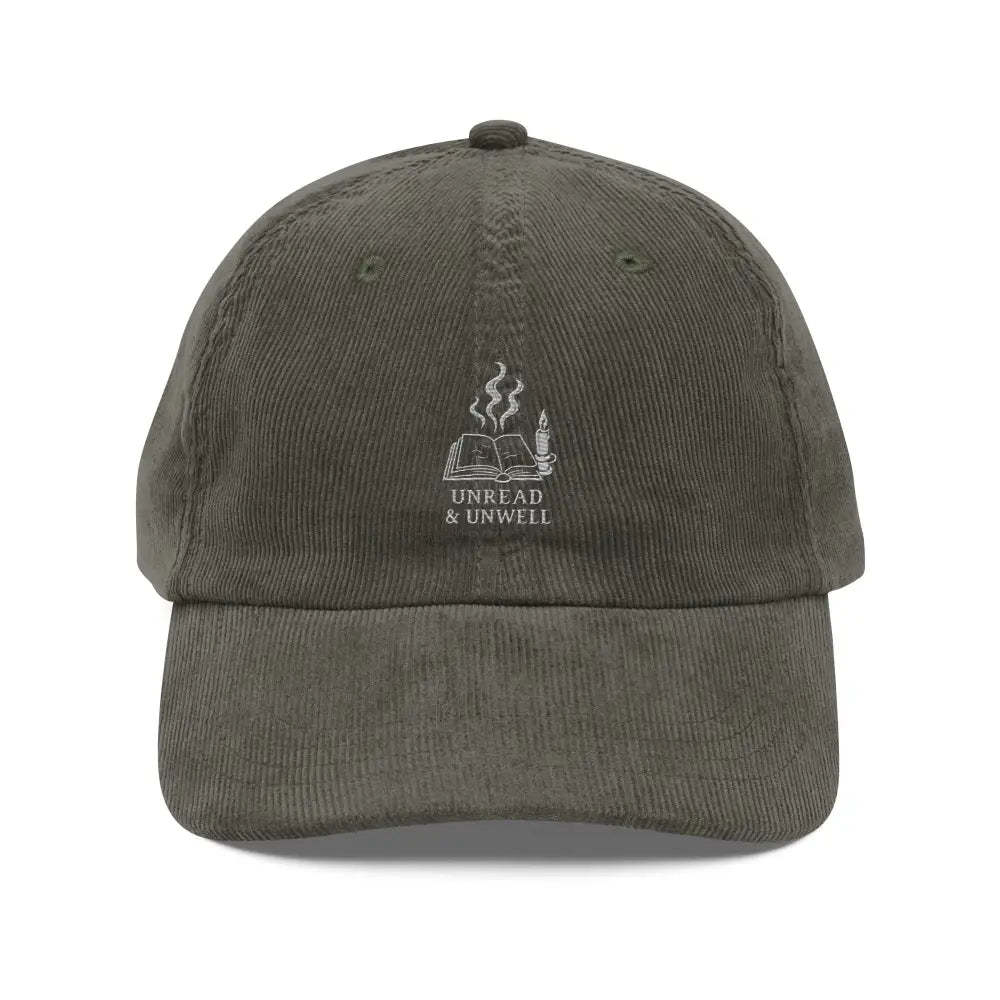 Dark green embroidered corduroy hat with book and candle design
