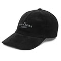 Black corduroy Bora Bora embroidered cap with minimalist white coastal embroidery and relaxed vintage resort aesthetic