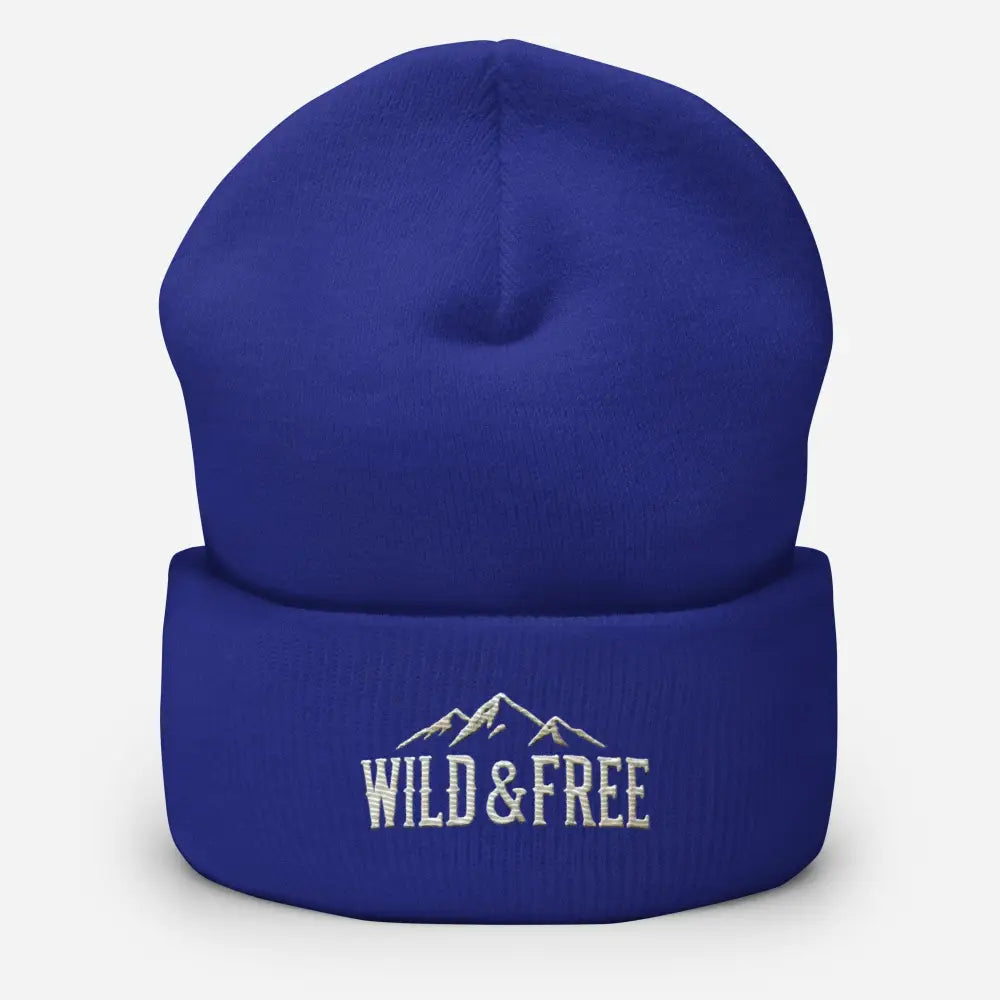 Royal blue cuffed beanie with embroidered mountains and Wild & Free text
