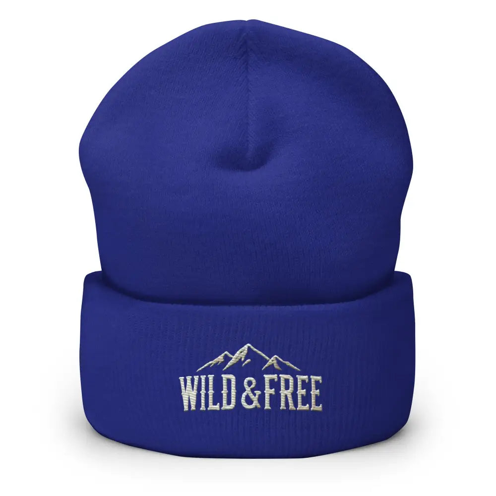 Royal blue cuffed beanie with embroidered mountains and Wild & Free text