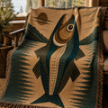 Wild Trout woven cotton throw on an leather chair at a lakeside camp — fishing gift blanket in teal and tan with fringe finish

