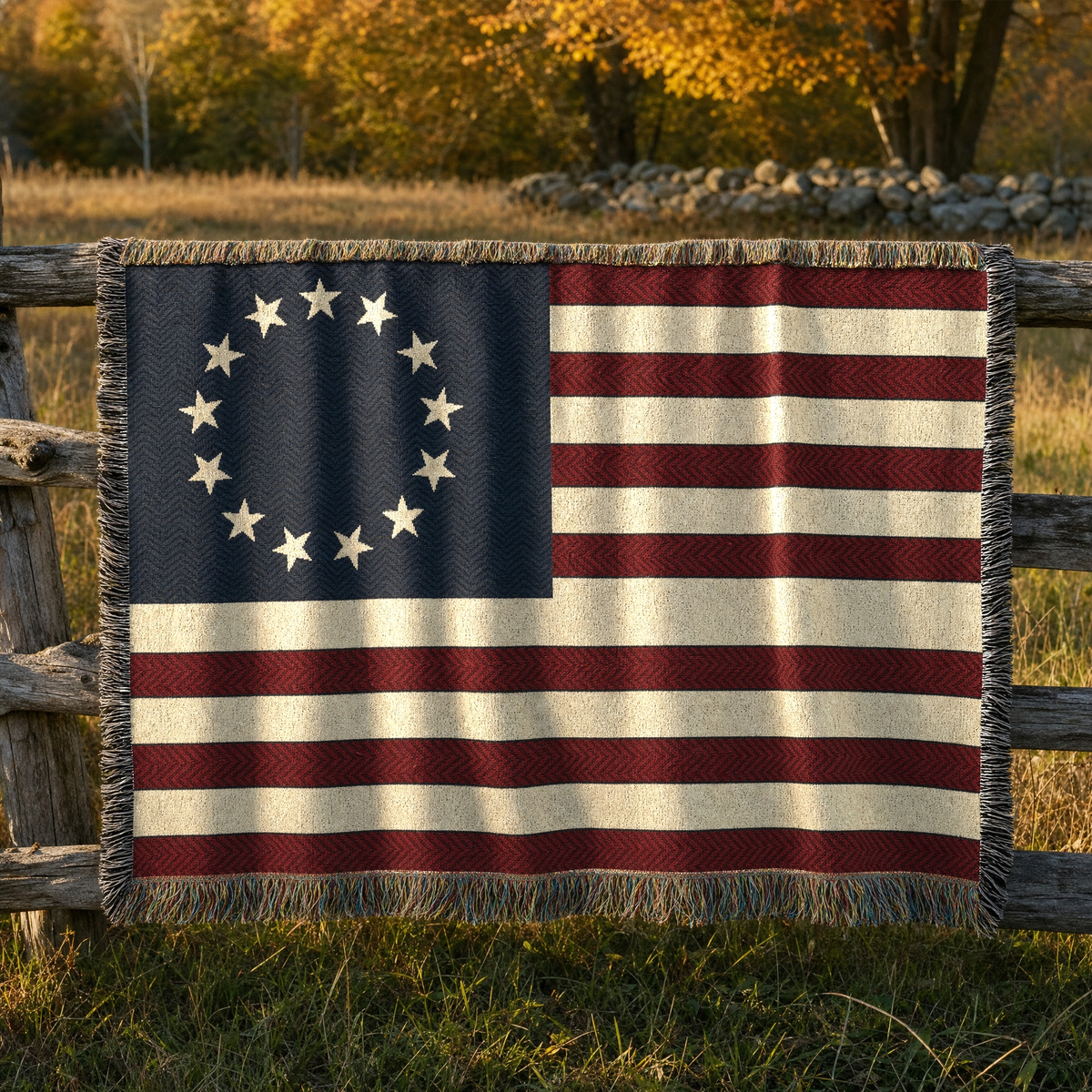 Betsy Ross flag cotton throw on a split-rail fence at the edge of a New England meadow at golden hour
