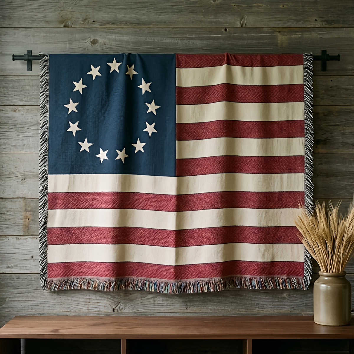 Betsy Ross 13-star flag woven cotton throw hung on a barnwood wall above a walnut console with dried wheat