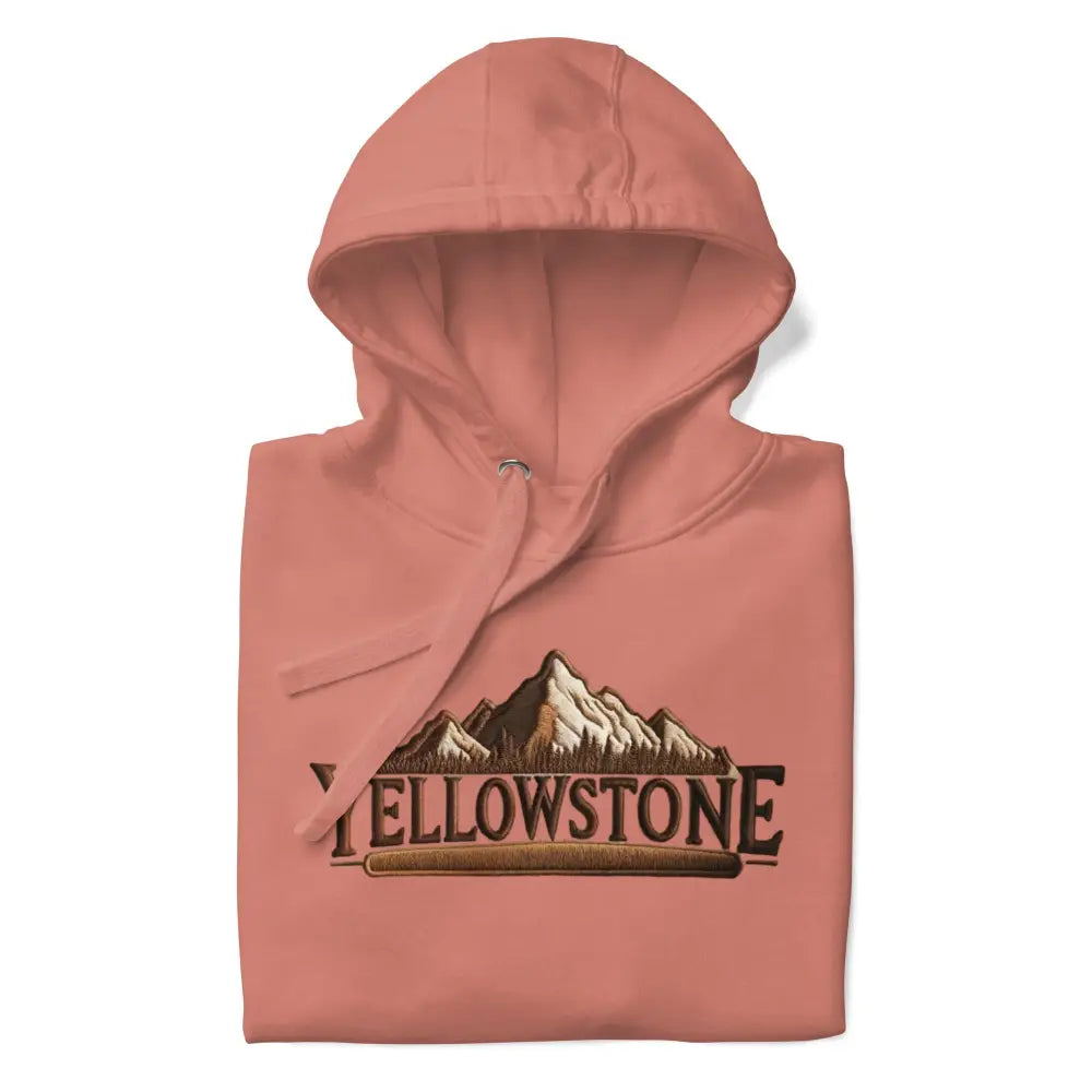 Folded peach Yellowstone-inspired unisex hoodie with mountain graphic for hiking nature lovers