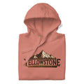 Folded peach Yellowstone-inspired unisex hoodie with mountain graphic for hiking nature lovers